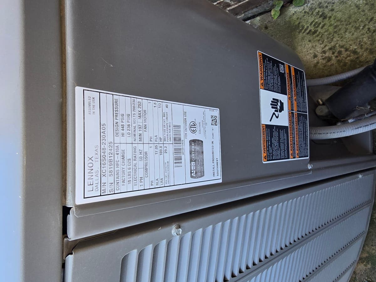 Condenser data plate showing model info during service in Lewisville TX