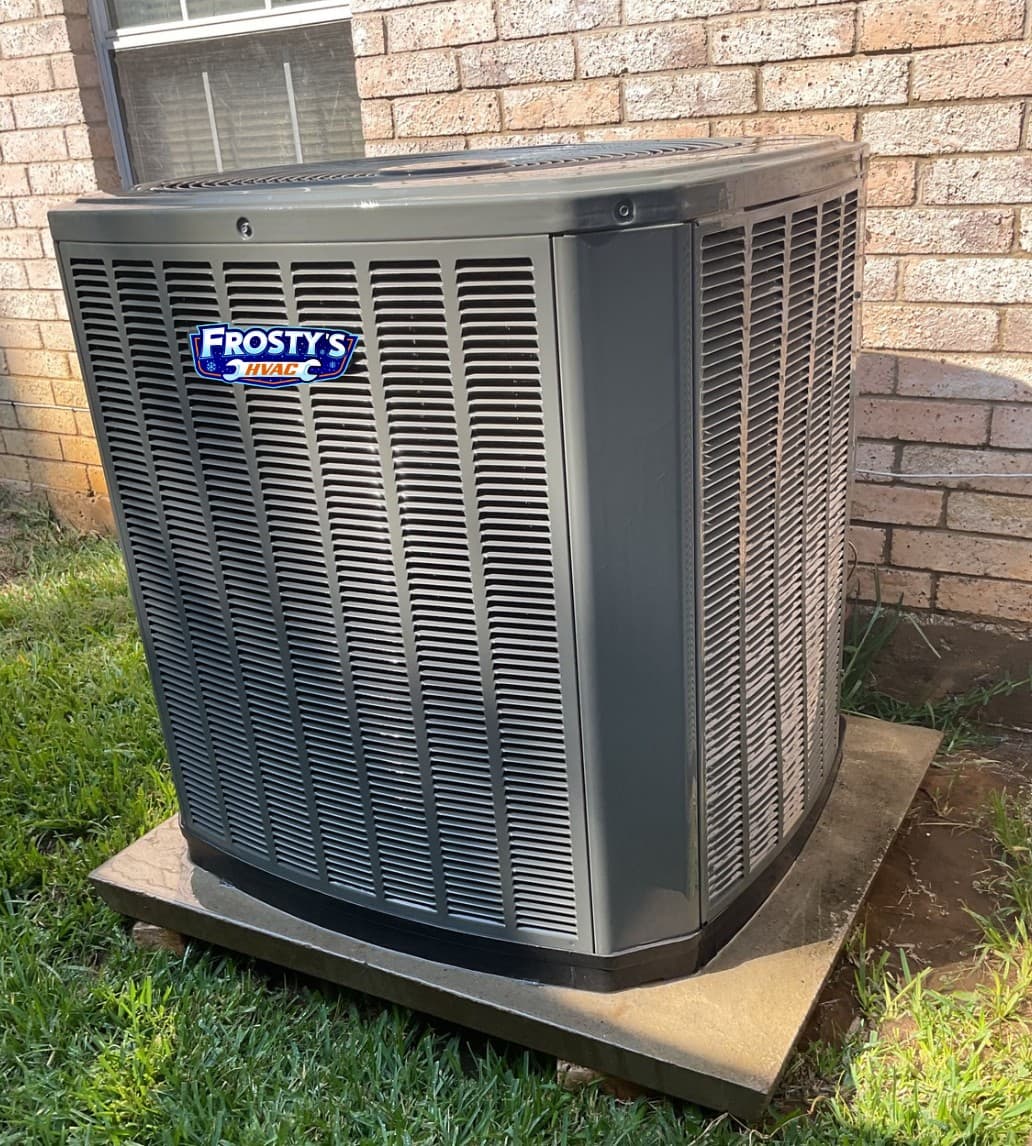 New Frosty's branded AC condenser installed at a brick home in Grapevine TX