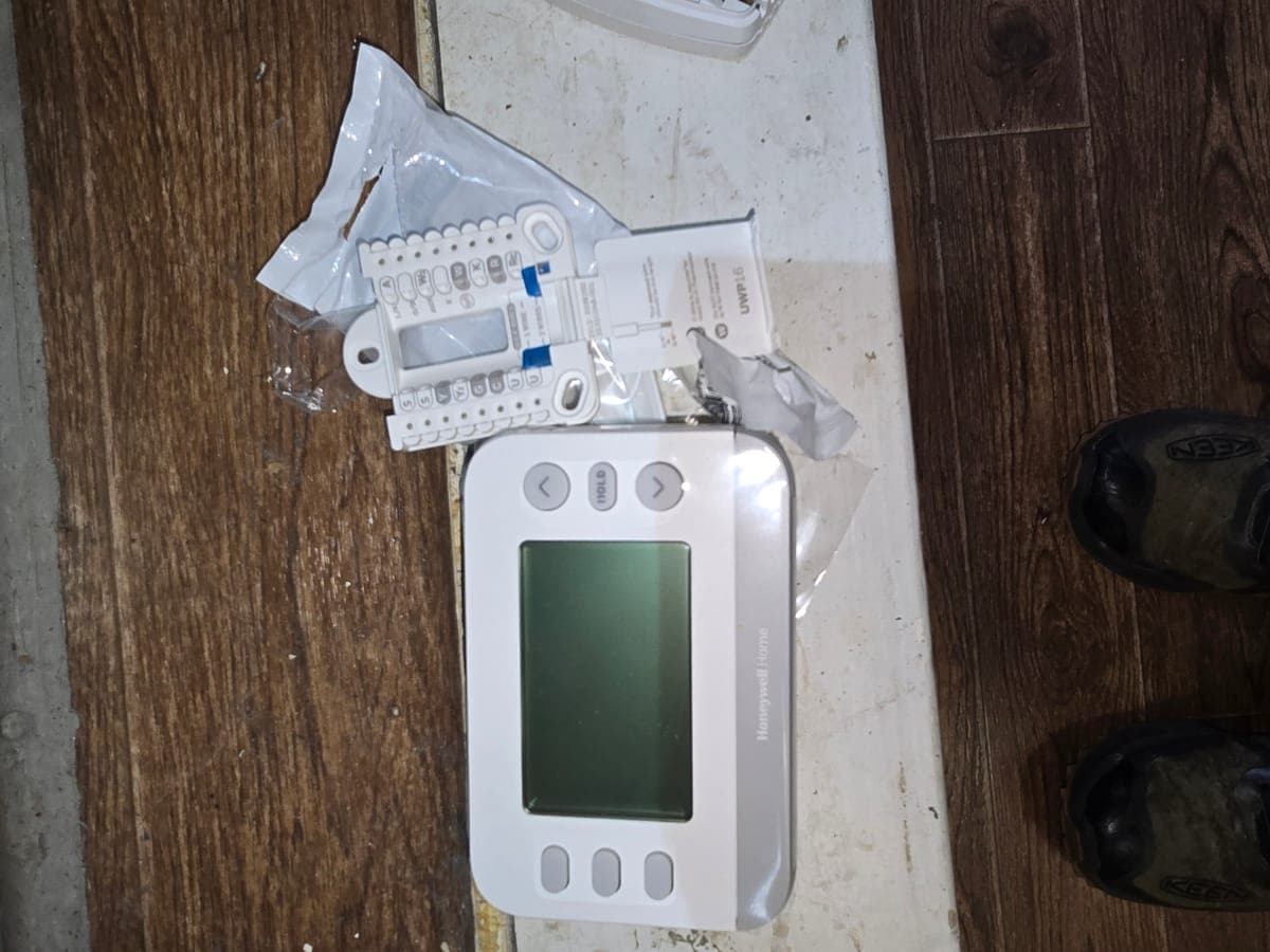 New thermostat unboxed and ready for installation at a Flower Mound home